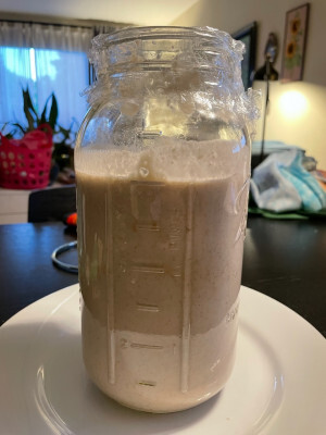 Milkshake just after feeding, the mix fills an 8-cup mason jar roughly to the 6-cup line