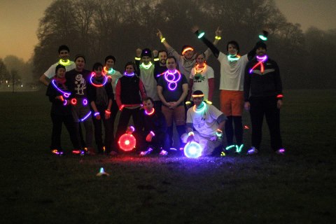 Group photo with glowsticks and glowing frisbees