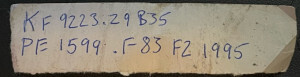Old strip of paper with two call numbers written on it: "KF 9223.Z9B35" and "PE 1599.F83 F2 1995"
