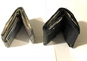 Two full wallets, one made of duct tape and one made of leather or a similar material