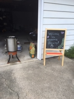 Brew Kettle and sign saying "Welcome to Grossdale Brewing!"