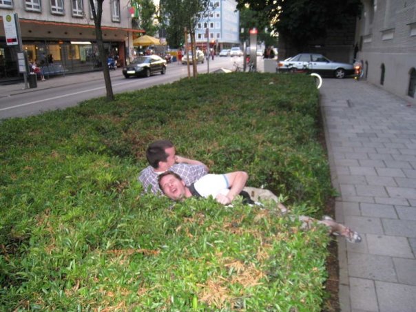 Pete and Tim in a bush/hedge they just jumped into