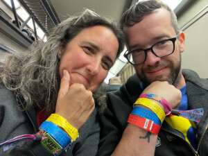 Jamie and Pete on the Metra home from Riot Fest showing off their wristbands
