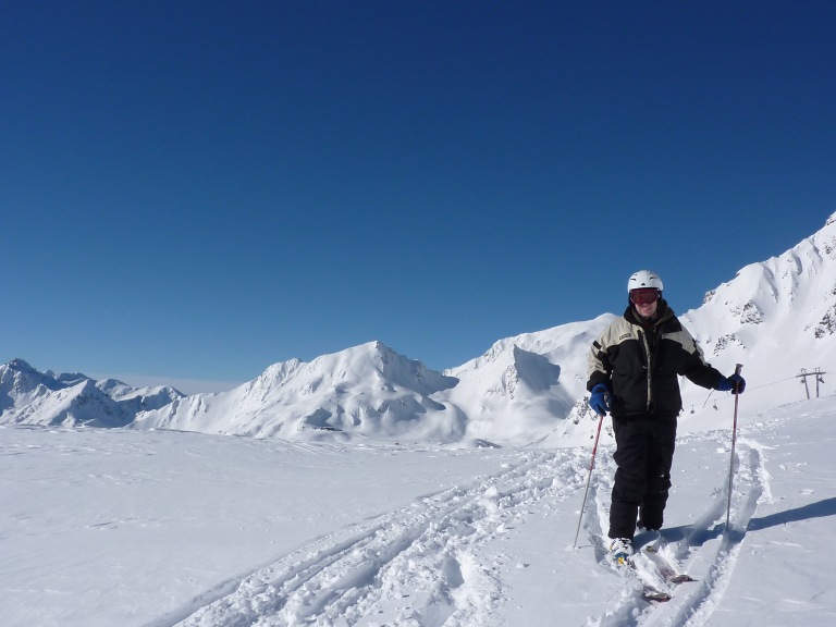 Pete standing on skis in a couple inches of powder