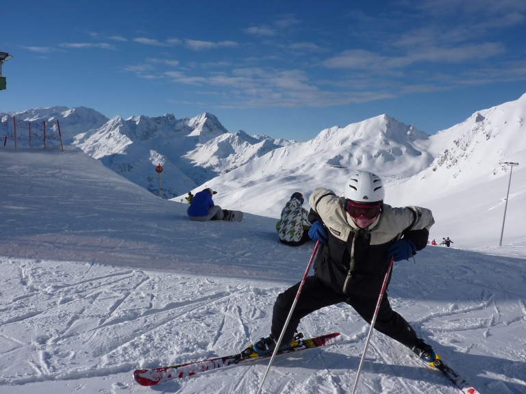 Pete on skis at the top of a slope