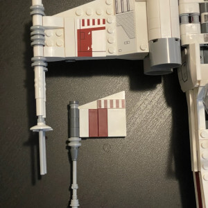 Comparison of the wing tip of the full X-Wing fighter and the wing tip from Dagobah. The Dagobah wing tip is smaller and has slightly less detail