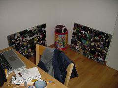 Corner of dining room with laptop, lego, and picture boards