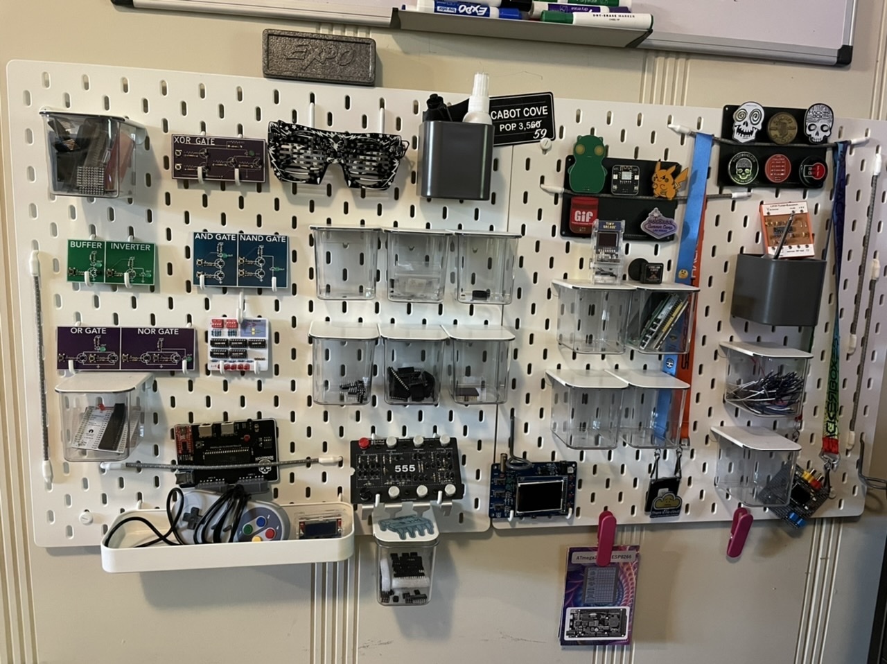 View of my pegboard wall featuring electronics projects