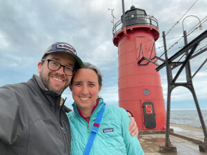 Jamie and Pete in front of the light house in South Haven